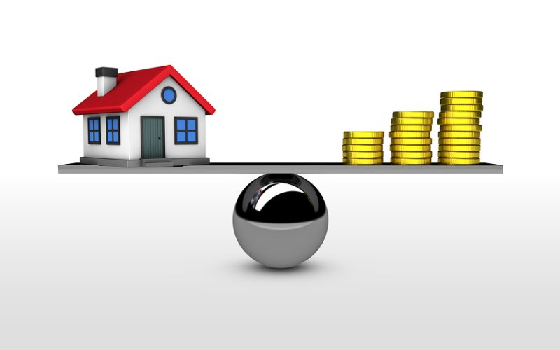 Property value house investment and mortgage concept with balance between home model and money 3D illustration.